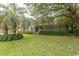 All brick, one story home with manicured landscaping, mature trees and green hedges across the front of the home at 18 Pine Valley Ln., Surfside Beach, SC 29575