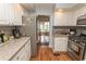 Updated kitchen with stainless appliances and granite counters overlooking dining area at 18 Pine Valley Ln., Surfside Beach, SC 29575