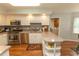 Kitchen features stainless steel appliances, granite countertops, and ample cabinet space at 18 Pine Valley Ln., Surfside Beach, SC 29575