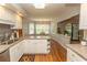 Bright kitchen with granite counters and white cabinets opens to dining area at 18 Pine Valley Ln., Surfside Beach, SC 29575