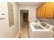 Well-equipped laundry room featuring a washer, dryer, and ample cabinet space for storage at 18 Pine Valley Ln., Surfside Beach, SC 29575