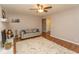 Comfortable living room featuring a cozy sofa, a ceiling fan, and a glimpse of the nearby rooms at 18 Pine Valley Ln., Surfside Beach, SC 29575