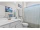 Bathroom with vanity, mirror, new faucet, and shower with relaxing blue shower curtain at 186 Ella Kinley Circle # 101, Myrtle Beach, SC 29588