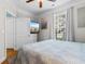 Relaxing bedroom with hardwood floors, natural light, TV and access to bathroom for convenience at 186 Ella Kinley Circle # 101, Myrtle Beach, SC 29588