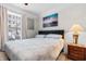 Cozy bedroom features natural light, ceiling fan, carpet and a beach-themed decor at 186 Ella Kinley Circle # 101, Myrtle Beach, SC 29588