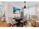 Dining room with modern lighting fixture and seating for six at 186 Ella Kinley Circle # 101, Myrtle Beach, SC 29588