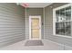 Unit entrance with a glass door and a window, nestled on the corner at 186 Ella Kinley Circle # 101, Myrtle Beach, SC 29588