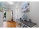 Hallway featuring wood floors, a console table with nautical decor, and access to the unit's entrance at 186 Ella Kinley Circle # 101, Myrtle Beach, SC 29588