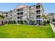 Charming condo building with lawn and Unit #101 including a screened-in porch at 186 Ella Kinley Circle # 101, Myrtle Beach, SC 29588