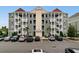 Attractive condo building with exterior staircases and ample parking in a coastal community at 186 Ella Kinley Circle # 101, Myrtle Beach, SC 29588