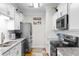 Well-lit kitchen with stainless steel appliances, and granite countertops at 186 Ella Kinley Circle # 101, Myrtle Beach, SC 29588
