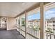 Exterior view of the balcony overlooking buildings and a parking lot at 1900 Duffy St. # H-8, North Myrtle Beach, SC 29582