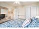Comfortable bedroom with blue accents, TV, and ample storage, creating a cozy atmosphere at 1900 Duffy St. # H-8, North Myrtle Beach, SC 29582