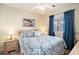Serene bedroom with coastal decor, comfy bedding, and natural light from the window at 1900 Duffy St. # H-8, North Myrtle Beach, SC 29582