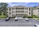 Three-story condo building with parking and covered balconies at 1900 Duffy St. # H-8, North Myrtle Beach, SC 29582