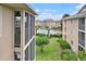Exterior view showcasing well-maintained buildings, lush landscaping, and a sparkling pool at 1900 Duffy St. # H-8, North Myrtle Beach, SC 29582
