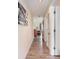 Hallway with laminate flooring leading to the living room at 1900 Duffy St. # H-8, North Myrtle Beach, SC 29582