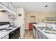 Efficient kitchen layout with sleek appliances, light countertops, and convenient access to storage at 1900 Duffy St. # H-8, North Myrtle Beach, SC 29582