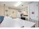 Charming kitchen with white cabinets and appliances, complemented by coastal-themed decor at 1900 Duffy St. # H-8, North Myrtle Beach, SC 29582