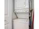 Compact laundry area with stacked washer and dryer, ideal for space-saving convenience at 1900 Duffy St. # H-8, North Myrtle Beach, SC 29582