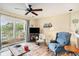 Cozy living room with ceiling fan and sliding glass door to balcony at 1900 Duffy St. # H-8, North Myrtle Beach, SC 29582