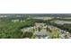 Scenic aerial shot showcasing the community, pond, and proximity to green spaces at 208 Hamilton Way, Conway, SC 29526