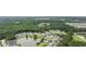 Beautiful aerial view of the home's location, nestled near lush woods and a tranquil pond at 208 Hamilton Way, Conway, SC 29526
