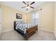 Cozy bedroom featuring plush carpet, ceiling fan, and a vintage quilt on the bed at 208 Hamilton Way, Conway, SC 29526