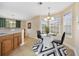 Bright breakfast nook featuring a glass table, modern lighting, and large windows at 208 Hamilton Way, Conway, SC 29526