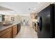 Modern kitchen showcasing stainless appliances, tile floors, and a functional layout at 208 Hamilton Way, Conway, SC 29526