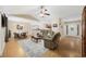 Spacious living room with wood floors, a ceiling fan, and an open concept design at 208 Hamilton Way, Conway, SC 29526