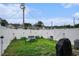 Well kept backyard with a white fence, furniture, landscaping and a grill at 2472 Bayboro St. # C, Loris, SC 29569