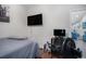 Bedroom with television, desk and view through door to a living room area at 2472 Bayboro St. # C, Loris, SC 29569