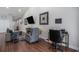 Open living area with modern decor, a comfortable recliner, and a workstation at 2472 Bayboro St. # C, Loris, SC 29569