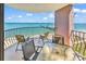 A charming balcony with panoramic ocean views and cozy furniture, perfect for relaxation and outdoor dining at 2500 N Ocean Blvd. # 1102, Myrtle Beach, SC 29577