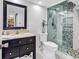 Modern bathroom featuring a glass-enclosed shower with mosaic tile accents and a stylish vanity at 2500 N Ocean Blvd. # 1102, Myrtle Beach, SC 29577