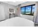 Relaxing bedroom with a large window offering stunning ocean views, perfect for a peaceful retreat at 2500 N Ocean Blvd. # 1102, Myrtle Beach, SC 29577