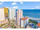Exterior shot of Myrtle Beach condos with ocean view and lush landscaping at 2500 N Ocean Blvd. # 1102, Myrtle Beach, SC 29577