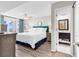 Bright main bedroom showcasing balcony access and an ensuite bathroom for added convenience at 2500 N Ocean Blvd. # 1102, Myrtle Beach, SC 29577