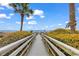 Scenic boardwalk path to beach with lush greenery and ocean views at 2500 N Ocean Blvd. # 1102, Myrtle Beach, SC 29577