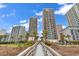 Charming boardwalk amidst lush foliage leading to the beach, lined by condos at 2500 N Ocean Blvd. # 1102, Myrtle Beach, SC 29577