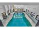 Spacious indoor pool area offering natural lighting, tables and chairs, and glass doors at 2500 N Ocean Blvd. # 1102, Myrtle Beach, SC 29577