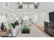 Open-concept living room with hardwood floors, fireplace, and modern decor at 2616 Elowen Ln. # 167B, Longs, SC 29568