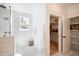 Spa-like bathroom with glass shower, linen storage and organized walk-in closet at 2729 Long Avenue Ext., Conway, SC 29526