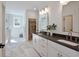 Bright bathroom featuring dual sinks, modern fixtures, and a walk-in closet for ample storage at 2729 Long Avenue Ext., Conway, SC 29526