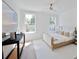 Bright bedroom with a modern ceiling fan, light wood floors, and a view to the backyard at 2729 Long Avenue Ext., Conway, SC 29526