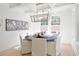 Inviting dining room with elegant light fixture, bright windows, and seating for six at 2729 Long Avenue Ext., Conway, SC 29526