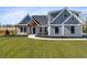 Beautiful single Gathering home showcasing impeccable landscaping and craftsman style architecture at 2729 Long Avenue Ext., Conway, SC 29526