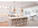 Bright, open kitchen with island seating, stylish pendant lights, and stainless steel appliances at 2729 Long Avenue Ext., Conway, SC 29526