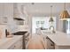 Gourmet kitchen featuring stainless appliances, custom white cabinetry, and seamless countertops at 2729 Long Avenue Ext., Conway, SC 29526